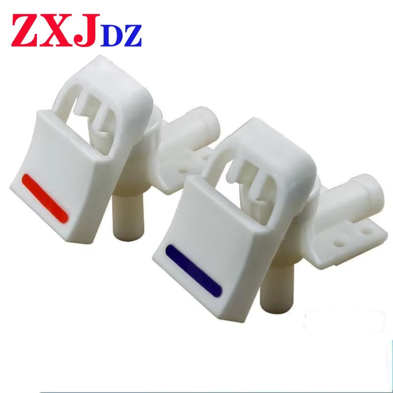 A pair of water dispensers faucets water faucets