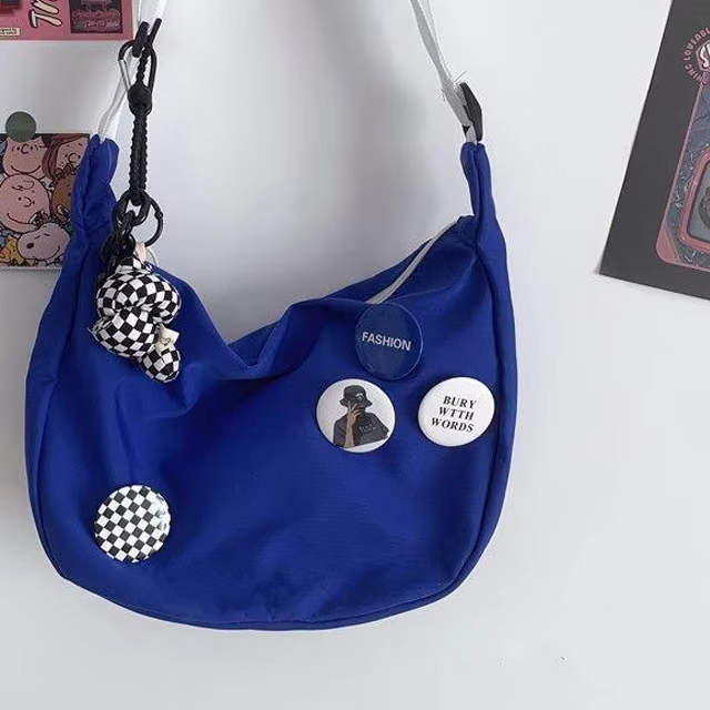 Women random badge half moon cross bag