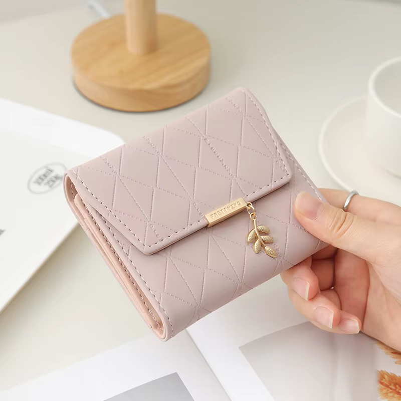 Autumn and winter new women's short wallet Japan and South Korea small fresh PU simple folding hardware leaf pendant three fold